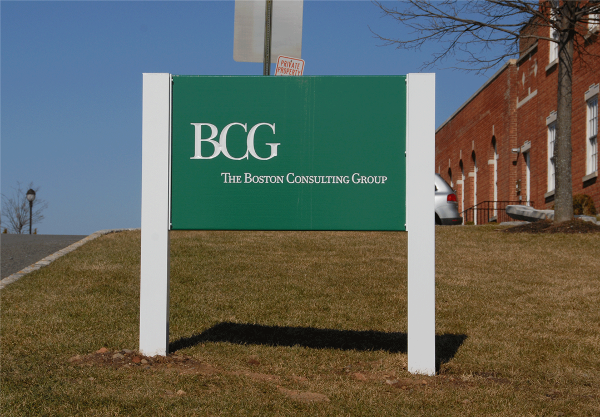 Carved, painted post and panel sign